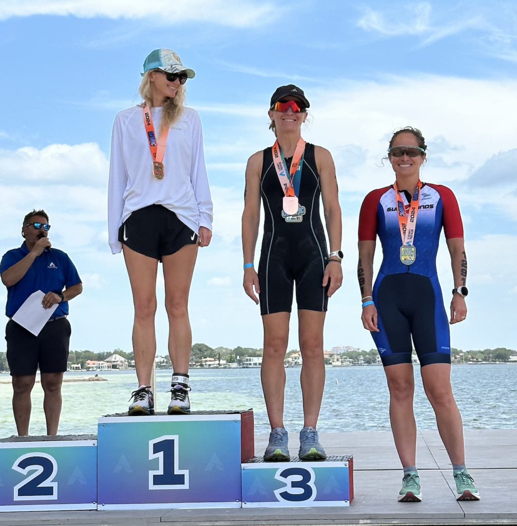 A female triathlete on a podium